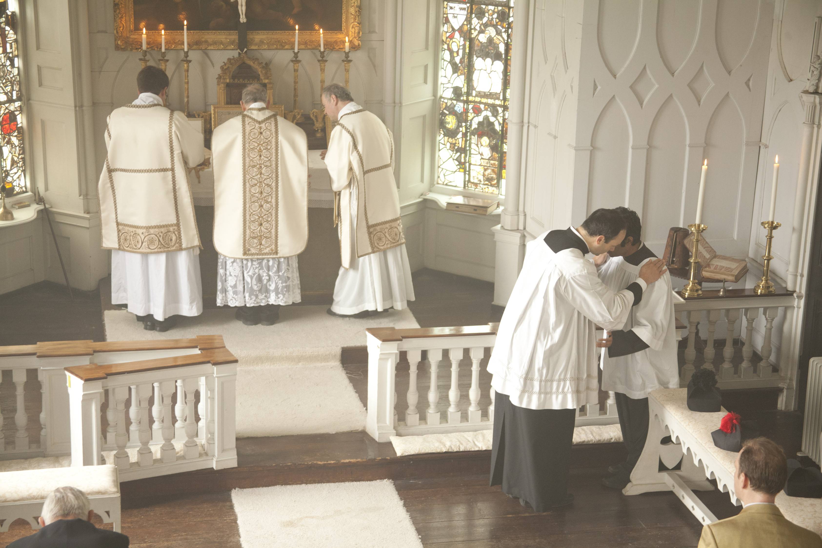 Solemn High Mass with the priest, deacon, and subdeacon at the altar